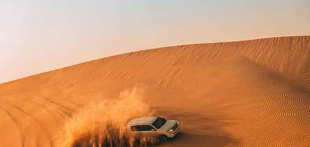 Foto 2 Abu Dhabi: Safari por el desierto de 6 horas con barbacoa, paseo en camello y Sandboarding