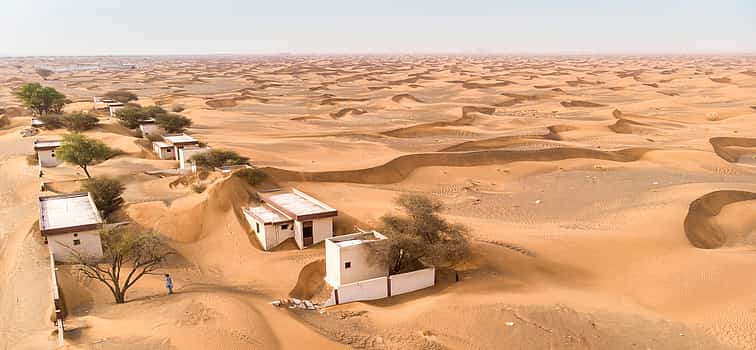 Photo 1 Private Ghost Village Safari Tour with Dune Bashing and Sandboarding